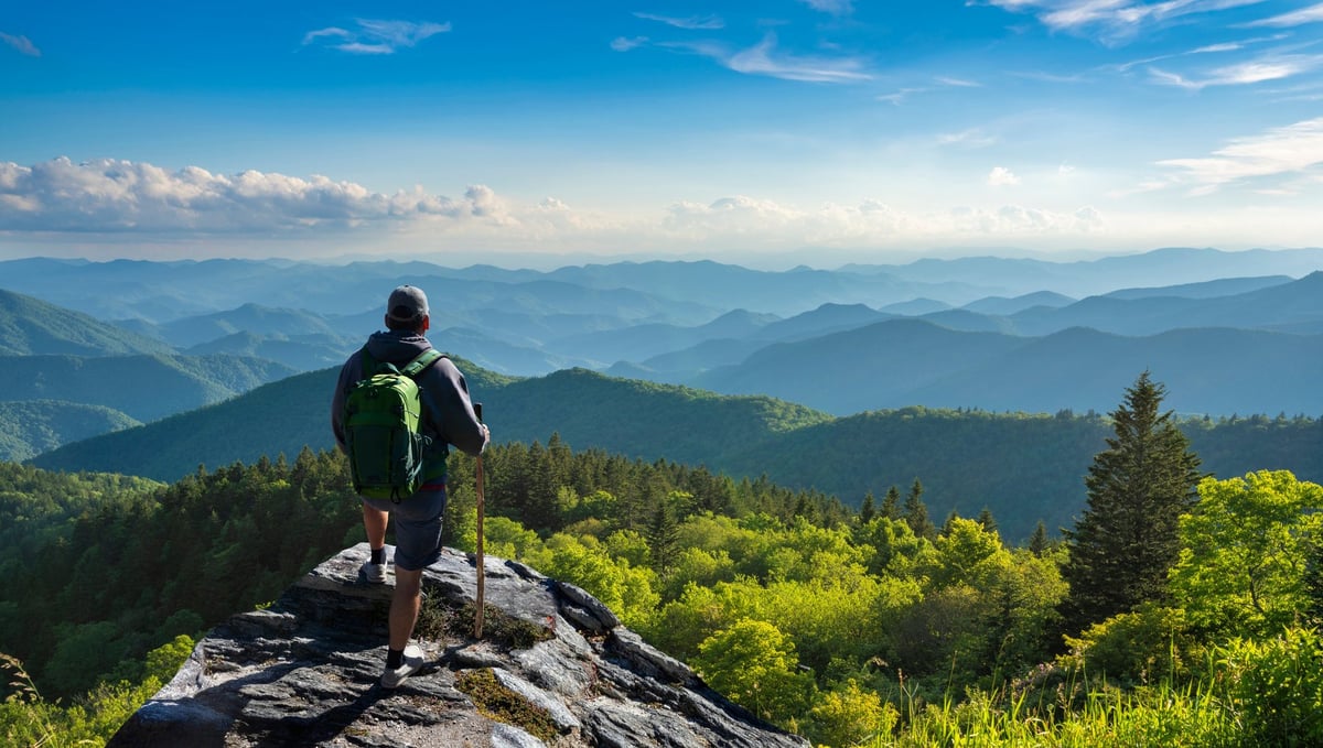 Hiker on top of mountain with beautiful fall scenery
