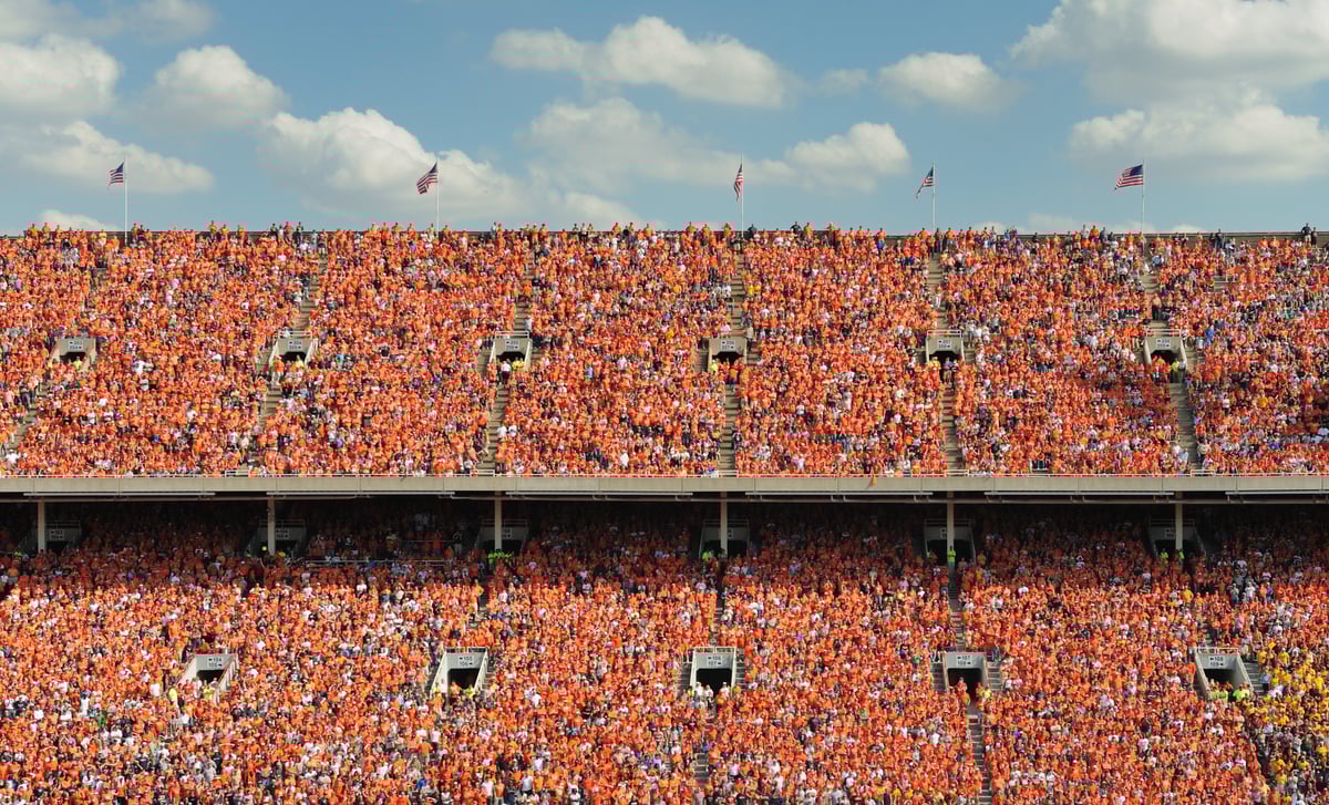 Crowd of thousands all dressed in orange