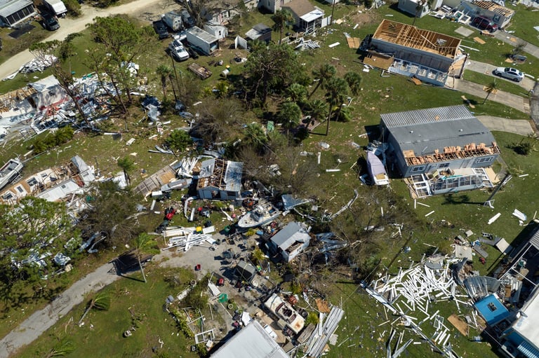 Severely damaged houses in a residential area after a hurricane