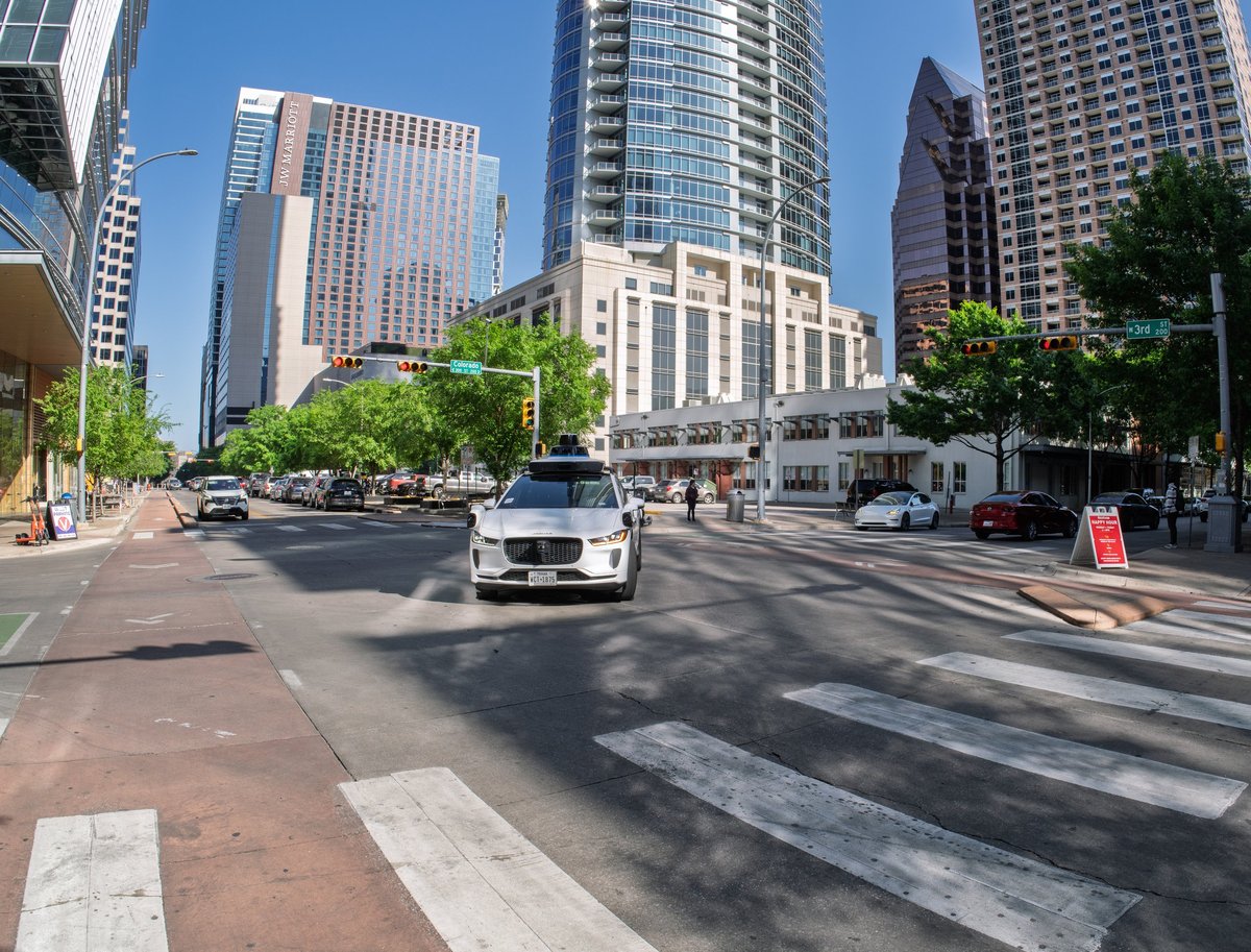 Modern city downtown with taxis and buildings