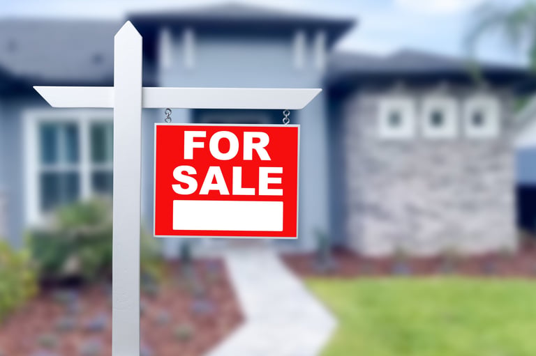 For sale sign in front of a home in Florence, SC reflecting the local housing market
