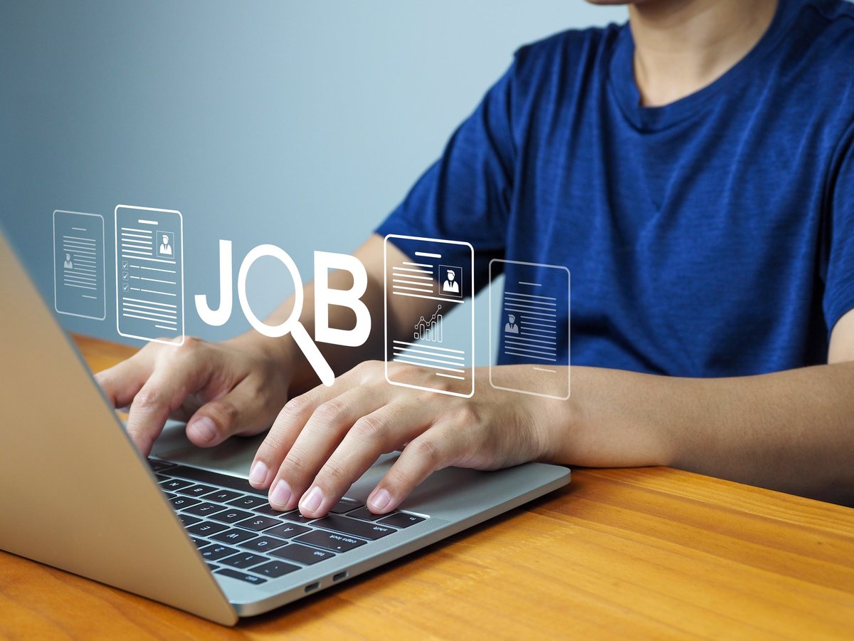 Job search concept with person typing on laptop