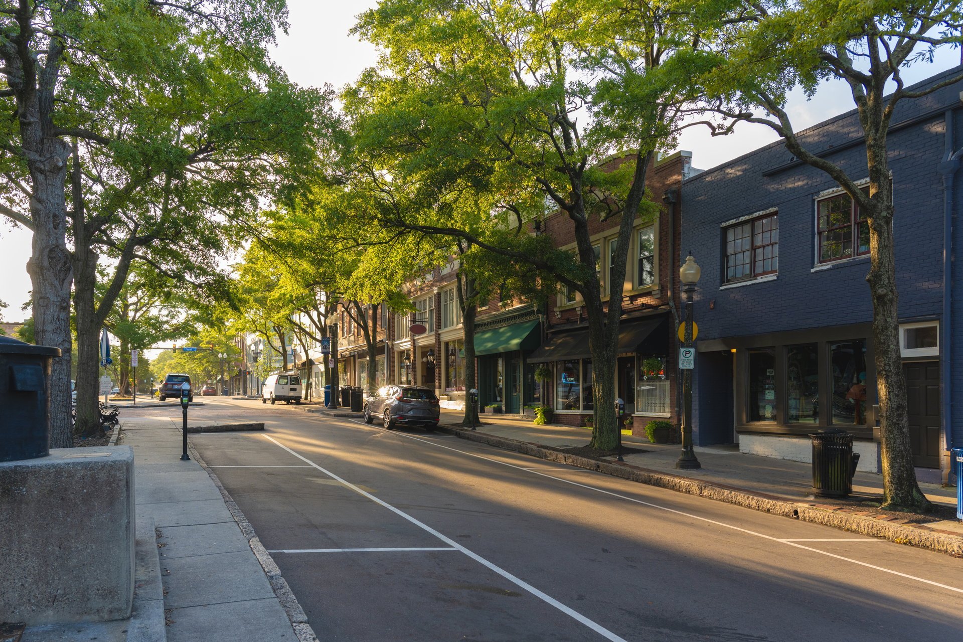 Historic downtown streetscape in the American South with early morning light on two-story brick buildings