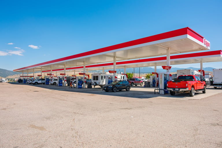 A large travel station with market and multiple gasoline pumps along the highway in the rural town of Butte, Montana, USA.