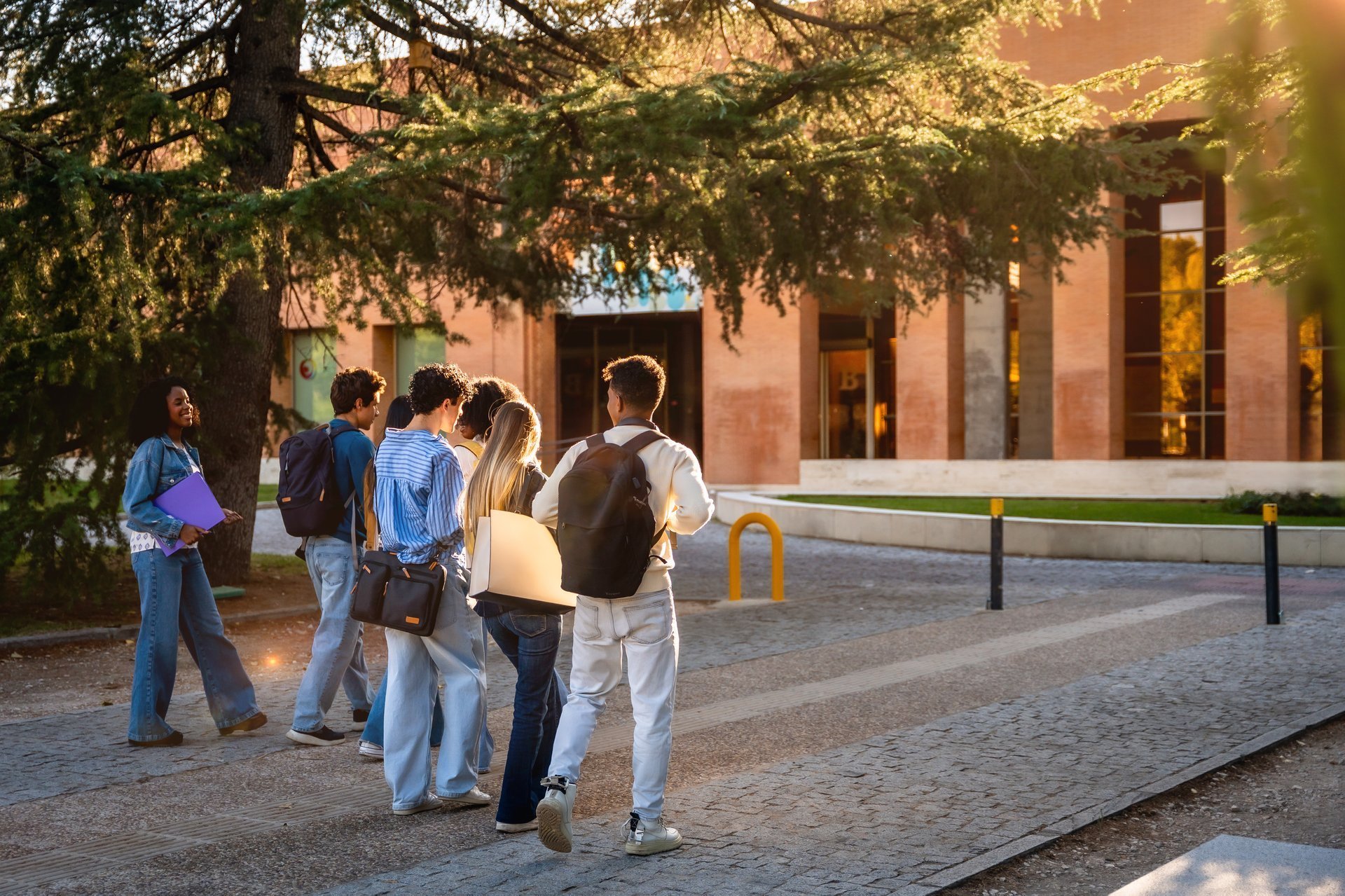 Group of students walking together on a university campus