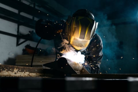 Professional welder working in workshop