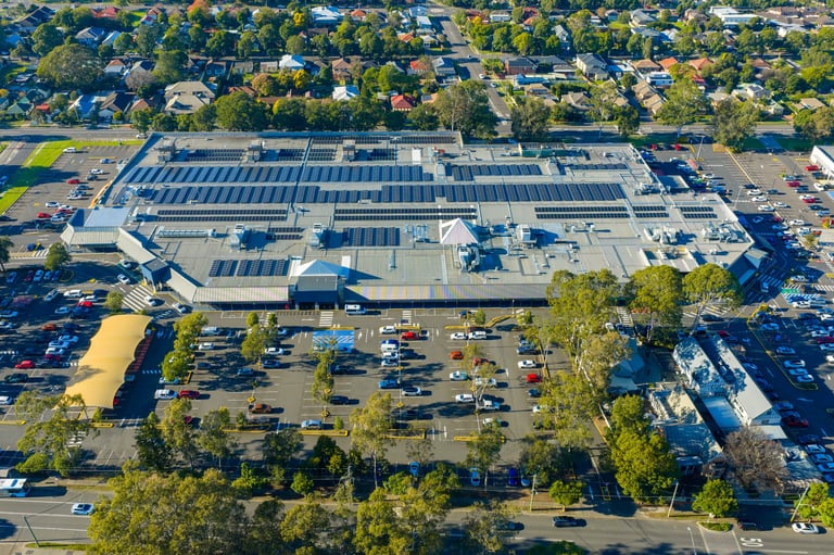 Aerial photograph of a large shopping centre and adjoining carpark in a residential precinct in the Western Sydney town of Penrith in New South Wales, Australia