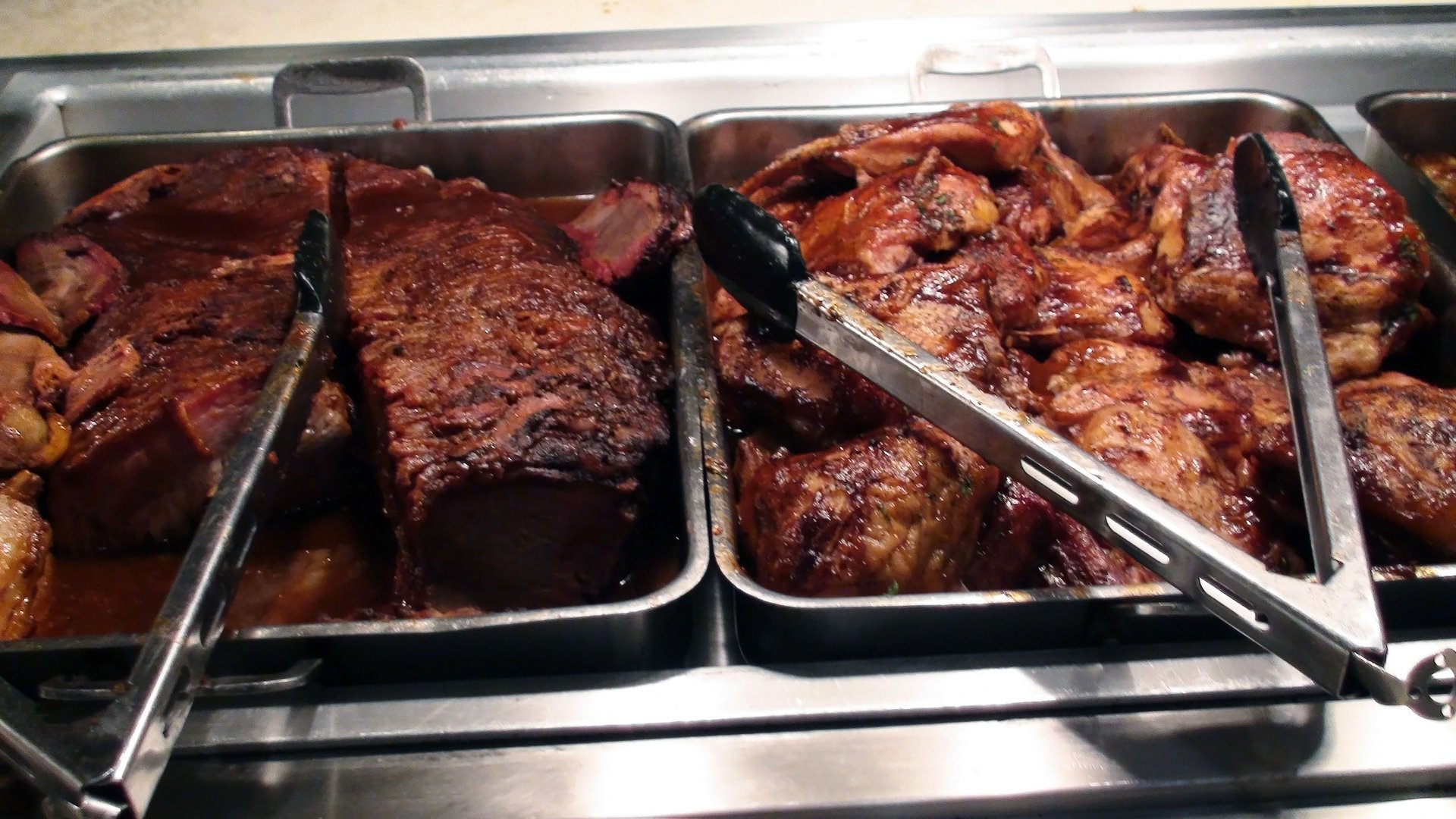 Variety of Southern BBQ and buffet meats at a restaurant
