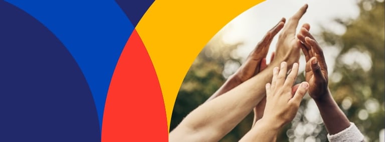 Diverse hands stacked together against colorful geometric background and outdoor trees, symbolizing unity and teamwork